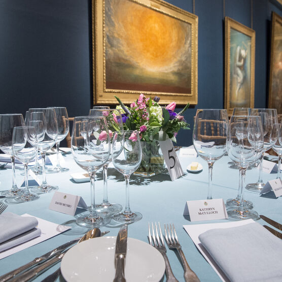 Table laid with flowers in middle