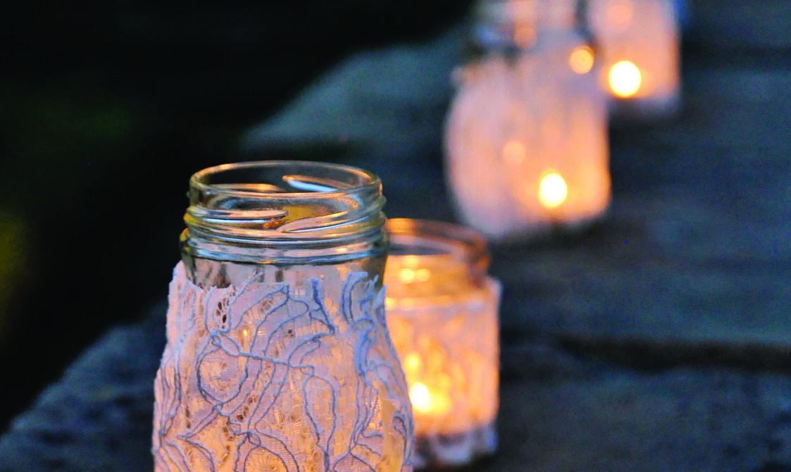 Candle lanterns lit up in a row